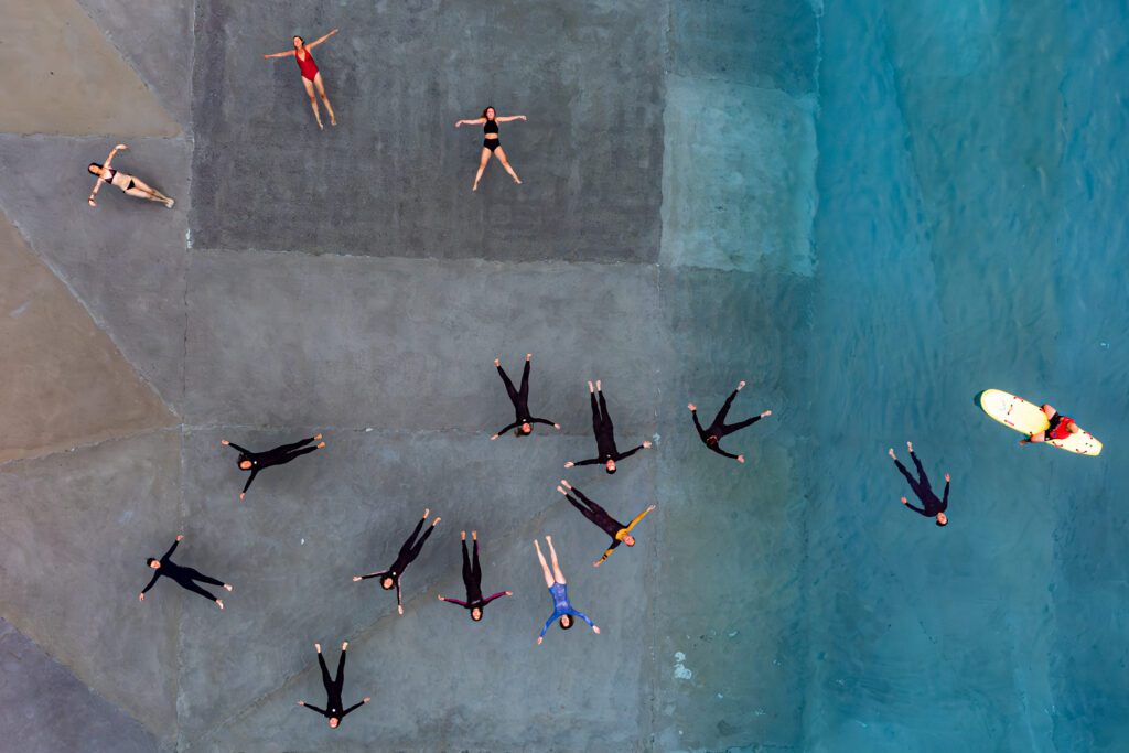 People float in inland surf lake The Wave during World Ocean Day