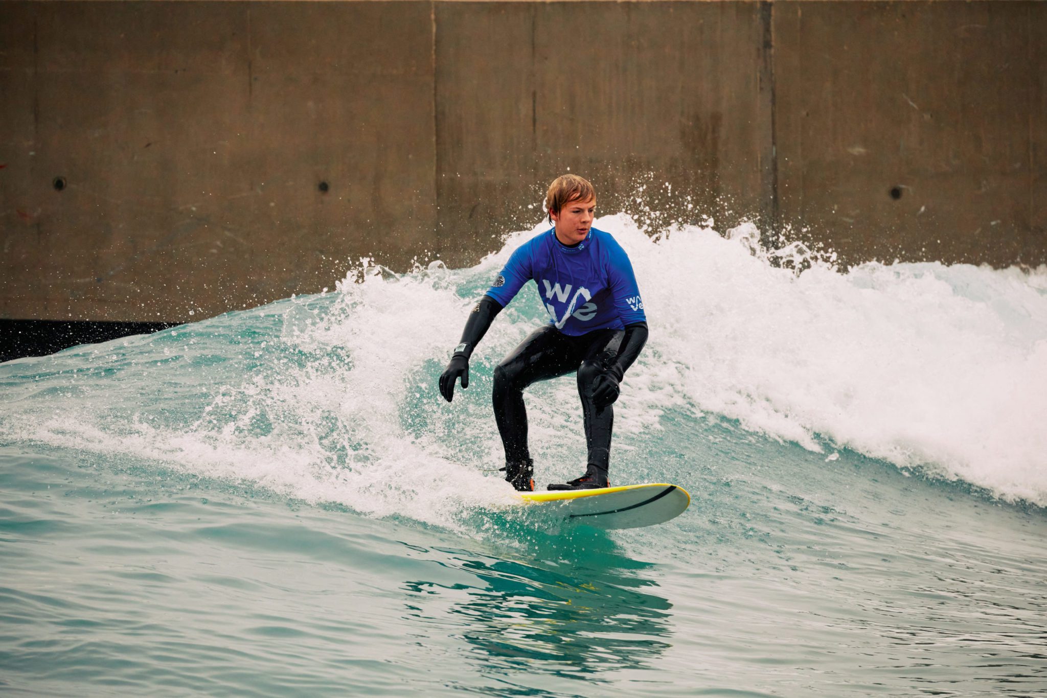 A man surfs an Intermediate wave at The Wave Bristol.